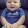 baby, child, smiling, blue_onesie, boat_print, hands, feet, sitting, plush_chair, cute, infant, portrait, happy, skin, face, head, eyes, mouth, fingers, toes