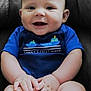 baby, smiling, blue_onesie, boats, cute, chubby_cheeks, sitting, hands, toes, face, child, infant, happy, indoor, cushion, chair, portrait, skin, young_child, comfortable