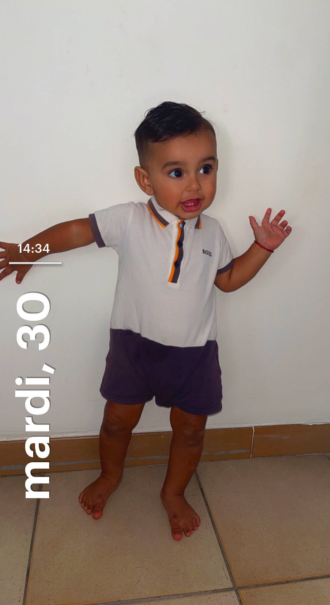 Rafael participe au concours pour gagner de l'argent avec cette photo : arm, baby_toddler_clothing, collar, dress_shirt, elbow, finger, flooring, formal_wear, gesture, happy, joint, knee, neck, person, shorts, shoulder, sleeve, standing, surprise, t_shirt