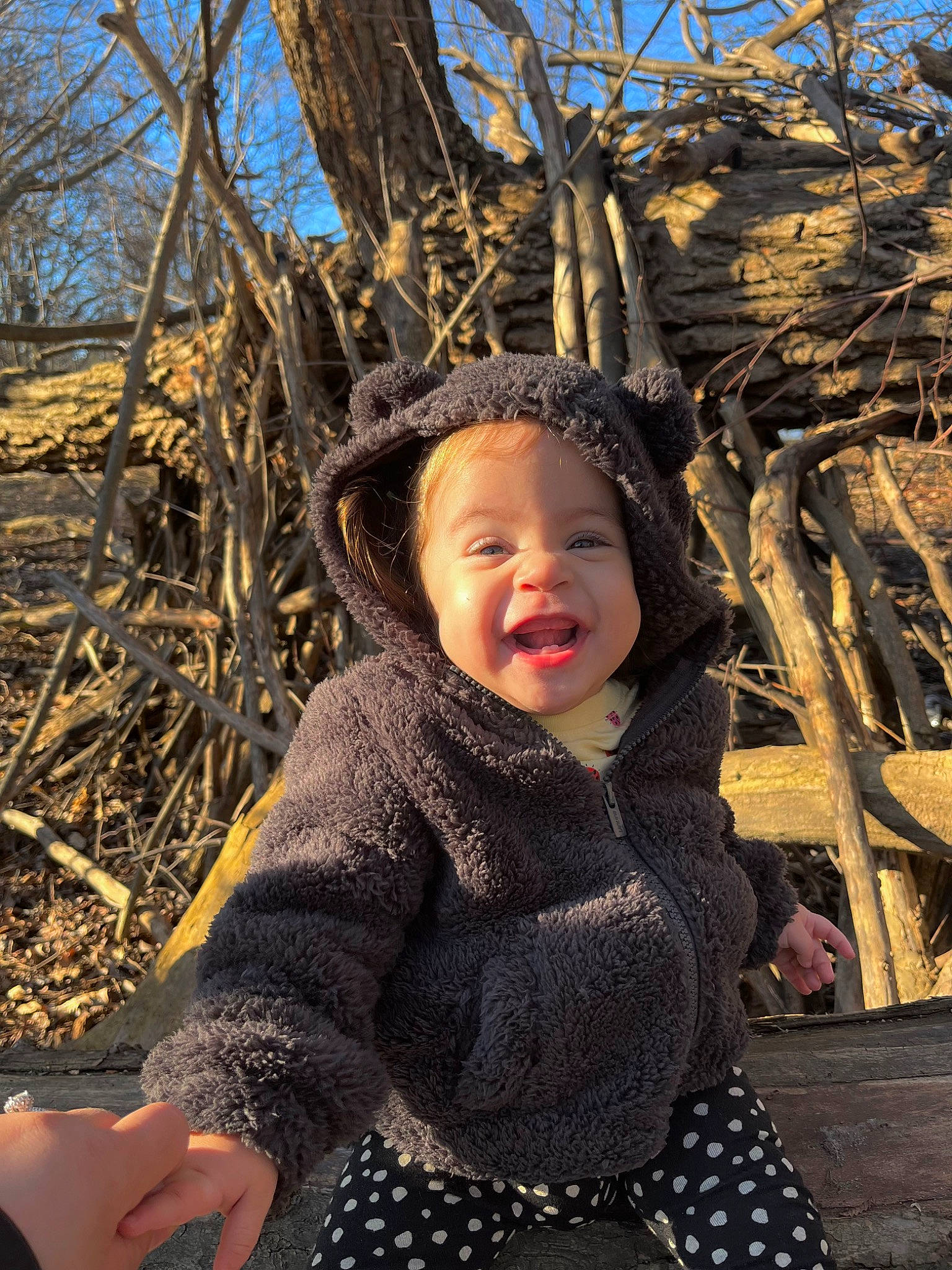 Jaylee is registered to the contest to win money with this photo: beauty, child, face, fun, grass, happy, headwear, leisure, outerwear, pattern, people, people_in_nature, person, photograph, sky, smile, toddler, tree, trunk, twig