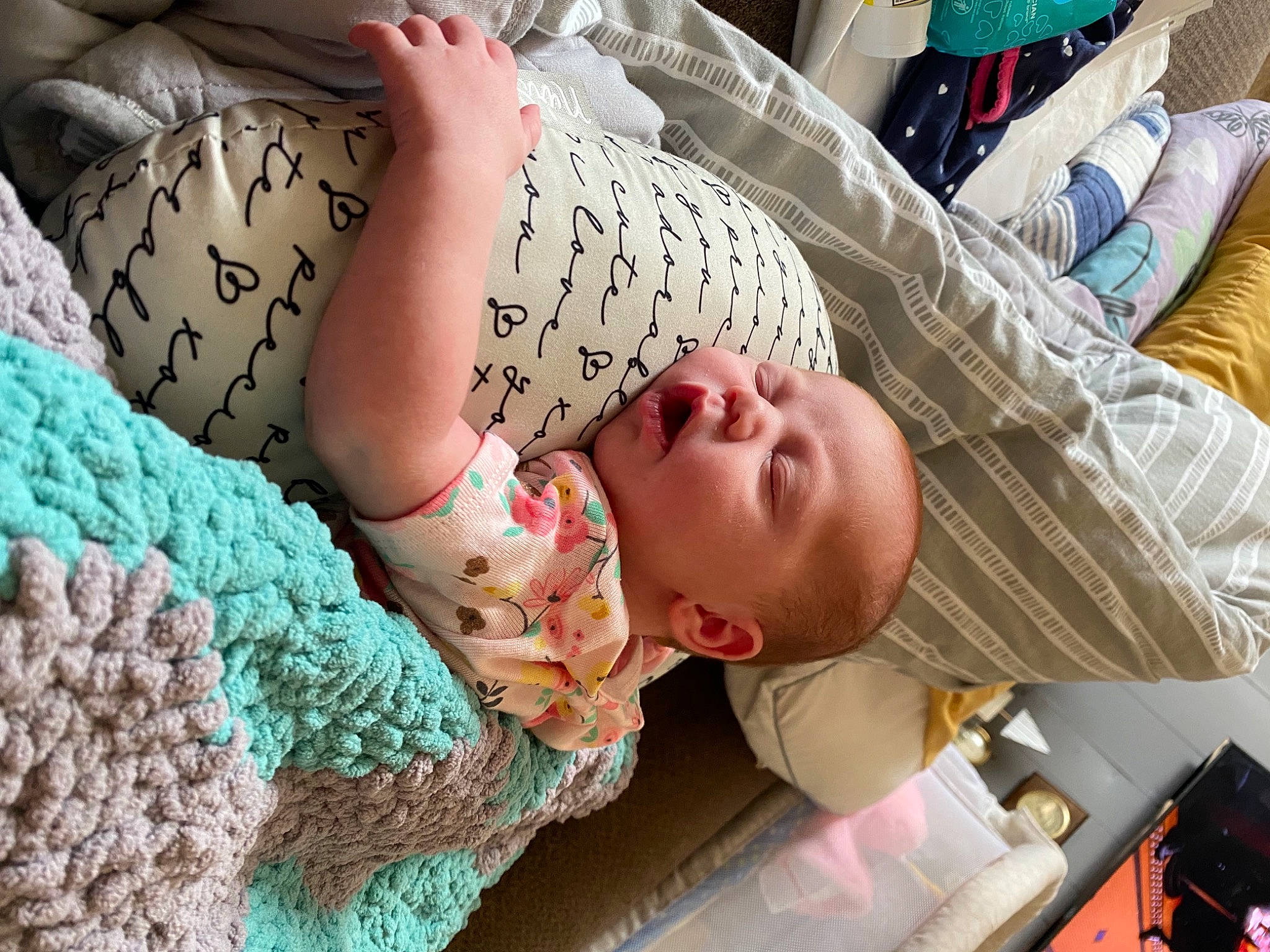 Henley is registered to the contest to win money with this photo: abdomen, baby, baby_products, bed, bedding, bedtime, blanket, child, comfort, linens, nap, pattern, people, person, quilt, room, sleep, textile, toddler