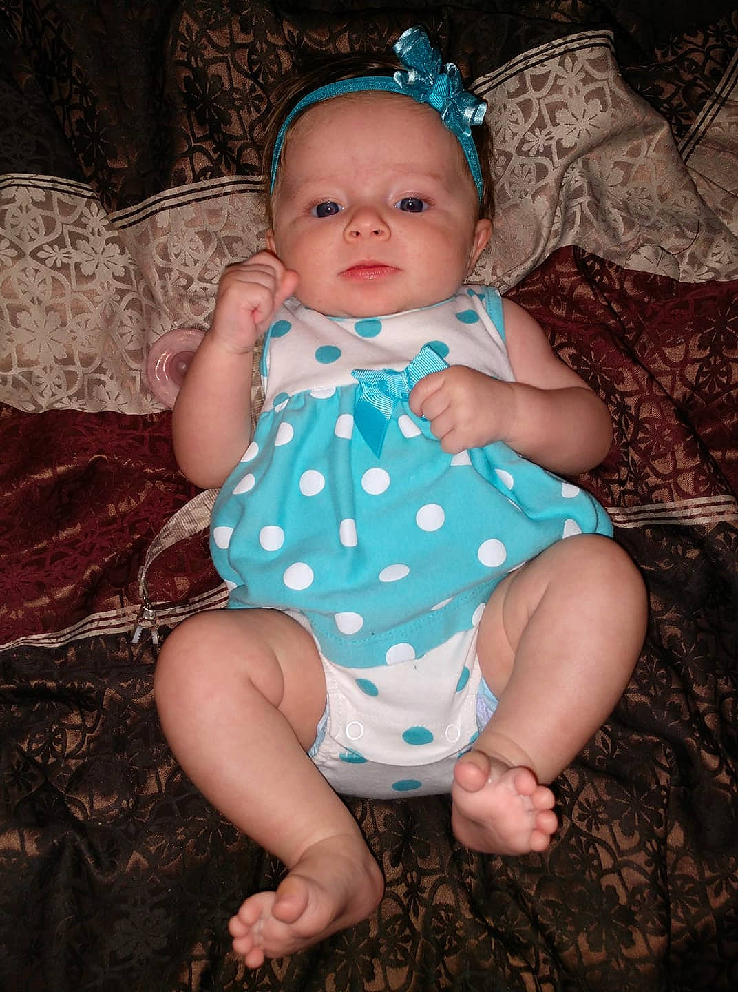 Blakely joined the competition — help win amazing prizes! baby, baby_toddler_clothing, child, design, eye, hair_accessory, iris, pattern, person, polka_dot, sitting, toddler, trunk, turquoise