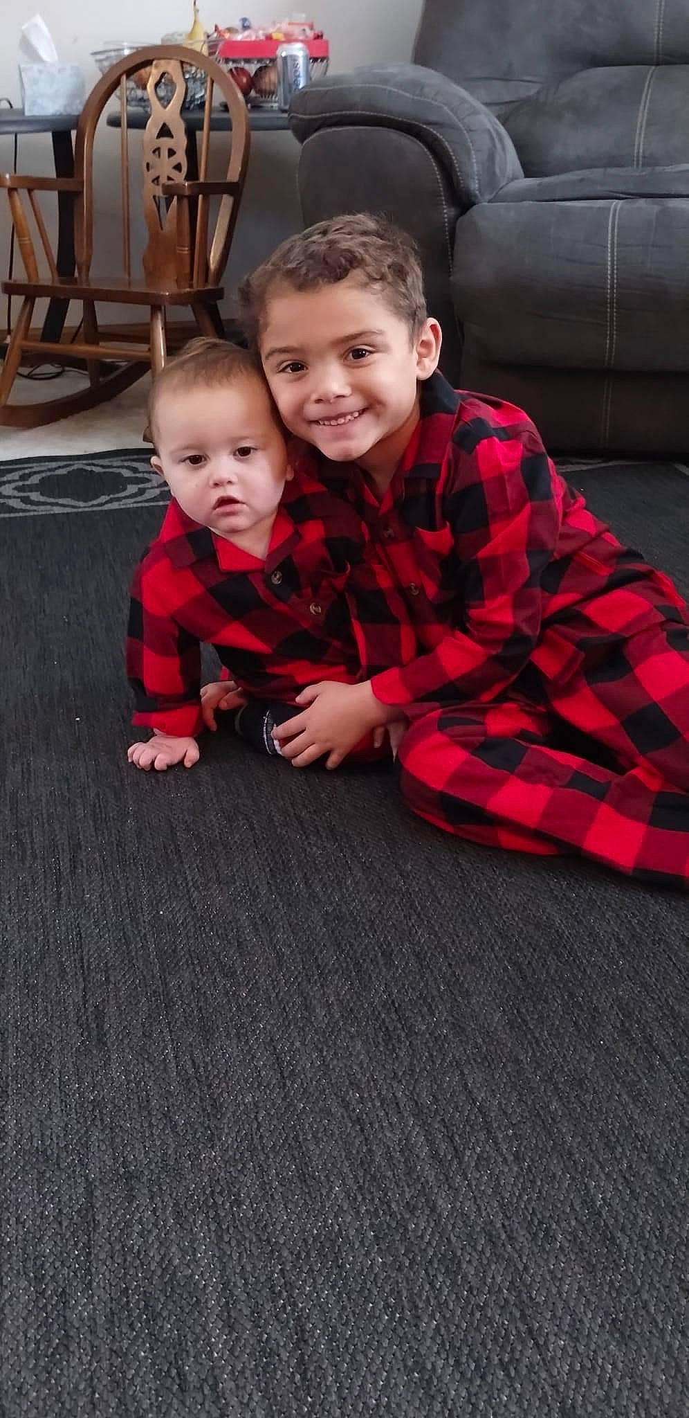 Daevion joined the competition — help win amazing prizes! baby, baby_toddler_clothing, comfort, event, face, floor, flooring, fun, grass, happy, hardwood, head, joy, pattern, person, plaid, room, sitting, smile, t_shirt