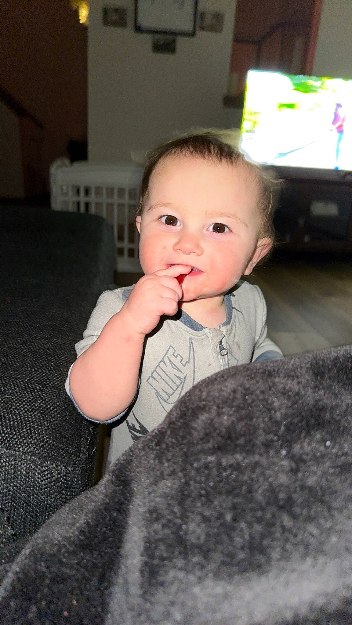 Kane is registered to the contest to win money with this photo: baby, baby_toddler_clothing, cheek, chin, comfort, eye, eyebrow, flash_photography, floor, flooring, fun, gesture, happy, head, iris, lip, nose, person, skin, sleeve