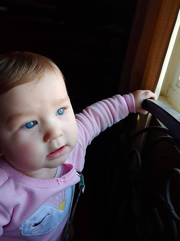 Monnrow Dawn is registered to the contest to win money with this photo: arm, baby, cheek, child, chin, cool, eye, face, finger, hand, head, lip, mouth, nose, person, pink, product, sitting, skin, smile