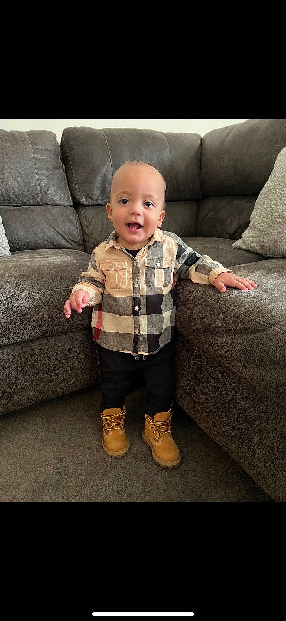 Dior is registered to the contest to win money with this photo: baby, baby_toddler_clothing, cheek, child, comfort, couch, eye, face, flooring, fun, happy, head, pattern, person, room, sitting, sleeve, smile, textile, toddler