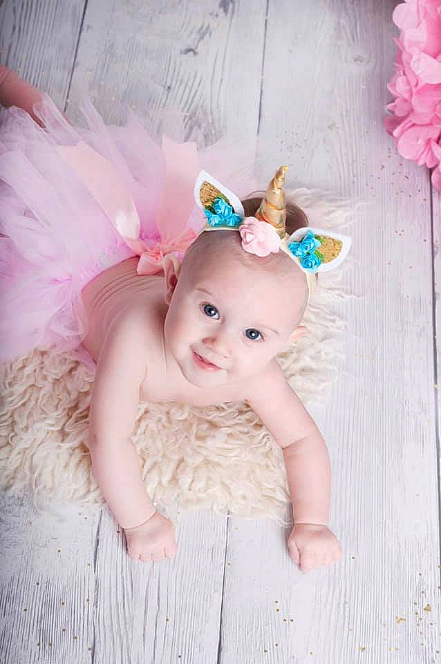 Calie participe au concours pour gagner de l'argent avec cette photo : baby, child, costume, costume_accessory, ear, fashion_accessory, fawn, fictional_character, fur, hair_accessory, headgear, headpiece, person, photography, pink, smile, toddler