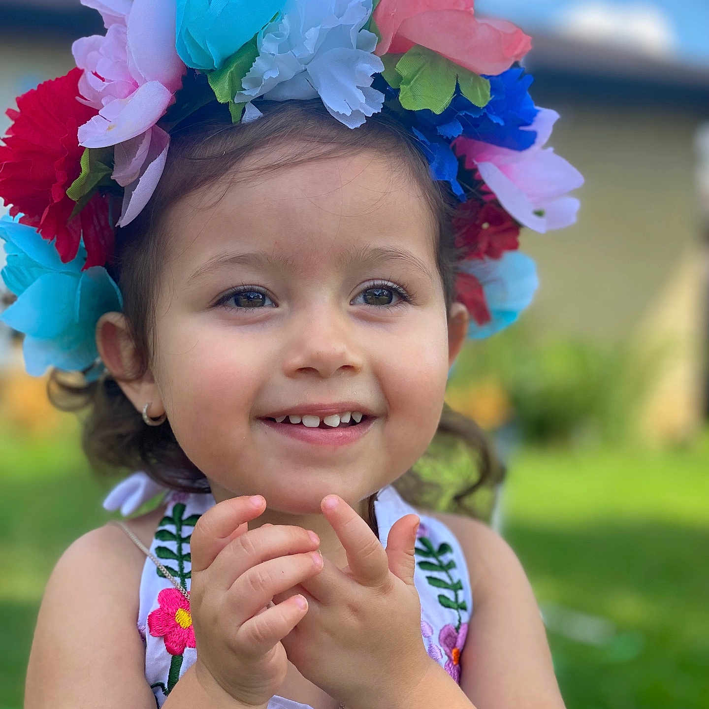 Aleena is registered to the contest to win money with this photo: accessories, baby, bodypart, clothing, dress, face, finger, flower, flowerarrangement, grass, hand, happy, head, person, petal, photography, plant, portrait, smile, summer