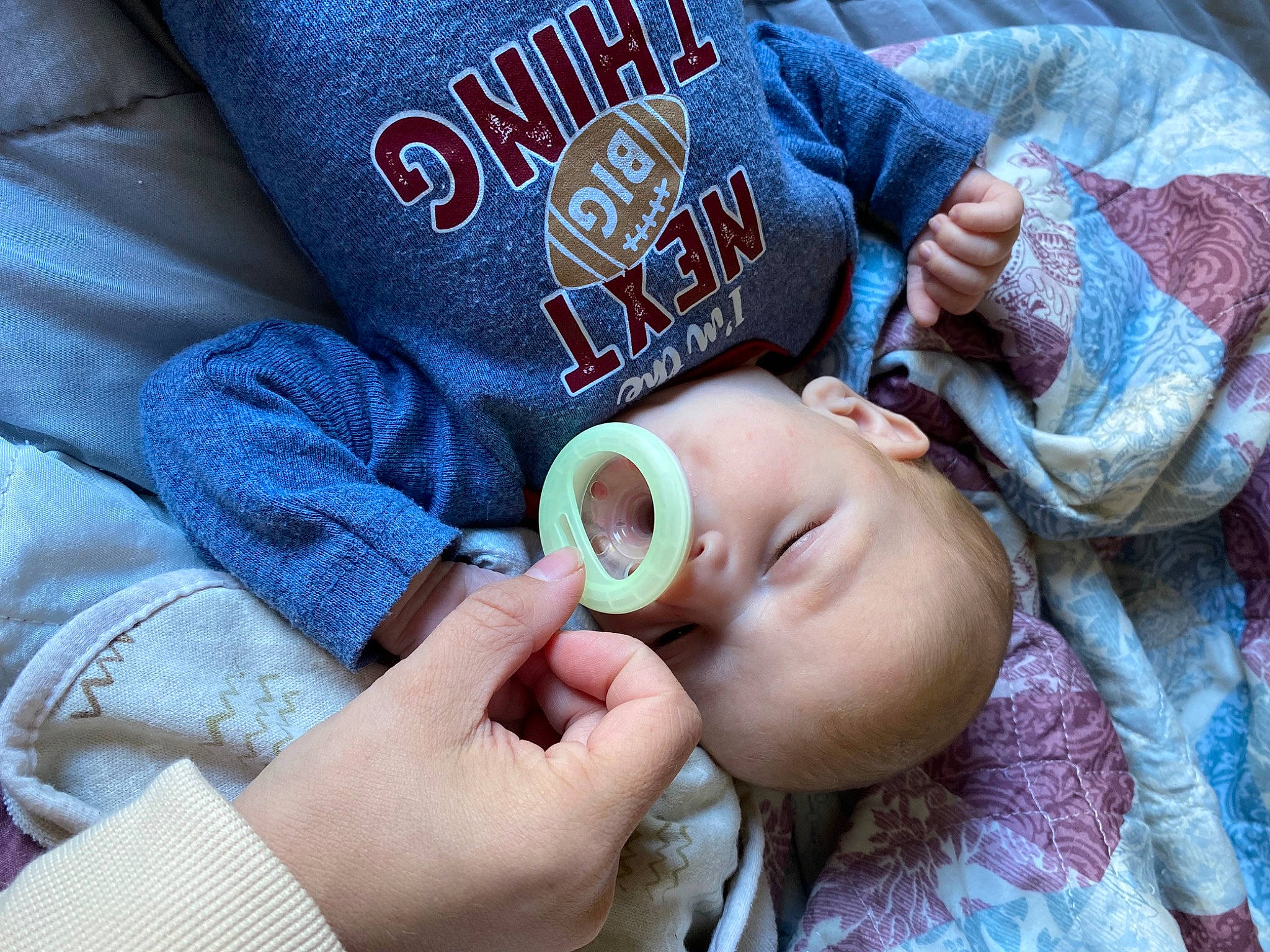 Braxton is registered to the contest to win money with this photo: baby, baby_toddler_clothing, child, electric_blue, eyelash, eyewear, finger, gesture, hand, happy, mouth, nail, nose, pattern, person, personal_protective_equipment, skin, sleeve, thumb, toddler