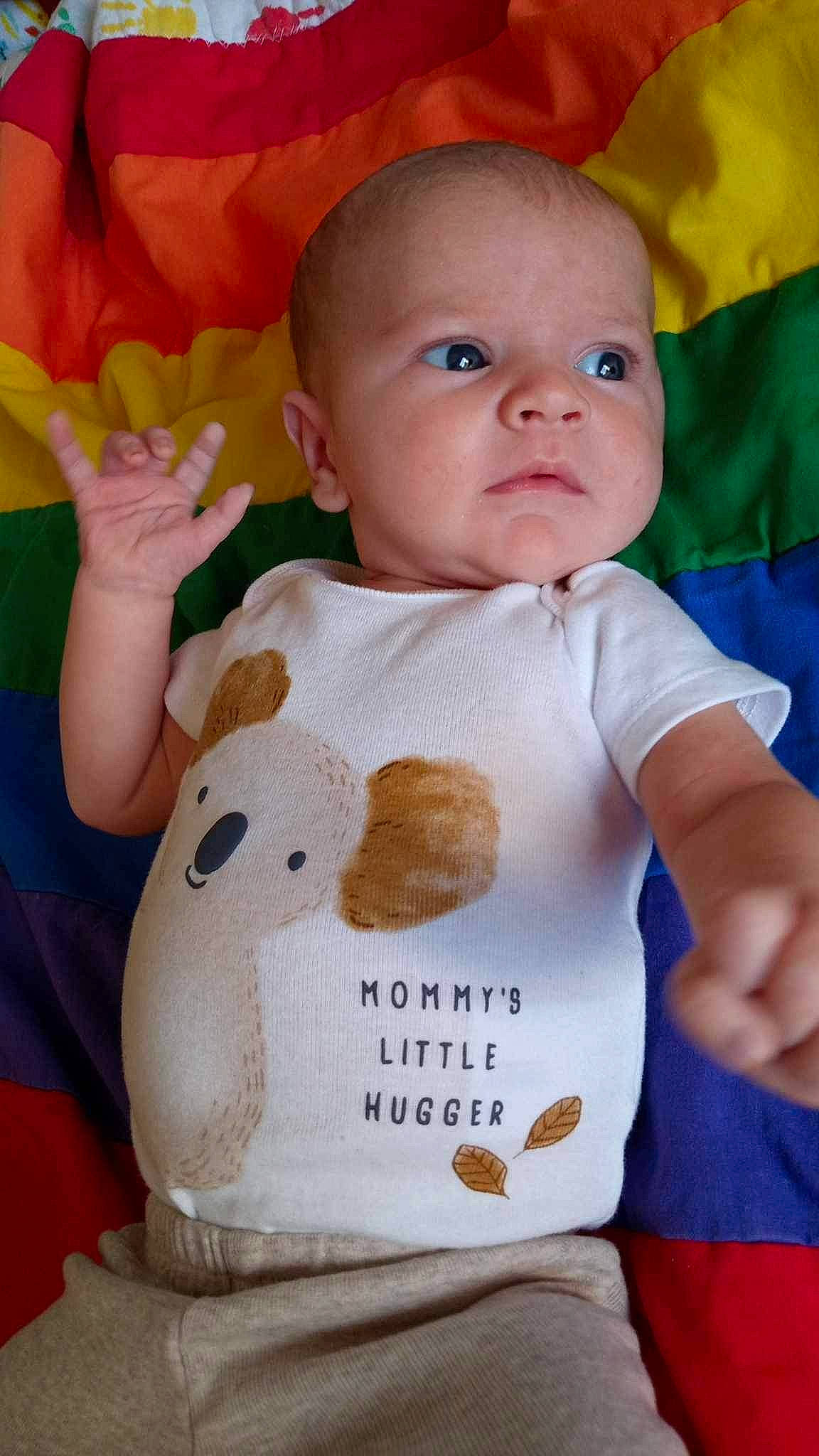 Braxton is registered to the contest to win money with this photo: baby, baby_toddler_clothing, cheek, child, finger, gesture, hand, happy, iris, joint, neck, nose, orange, person, product, skin, sleeve, t_shirt, textile, toddler