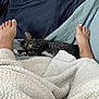 cat, sleeping, feet, blanket, bed, cozy, striped_cat, comfort, indoor, relaxation, paw, napping, human, toenail_polish, textile, cushion, fabric, foot, rest, warm