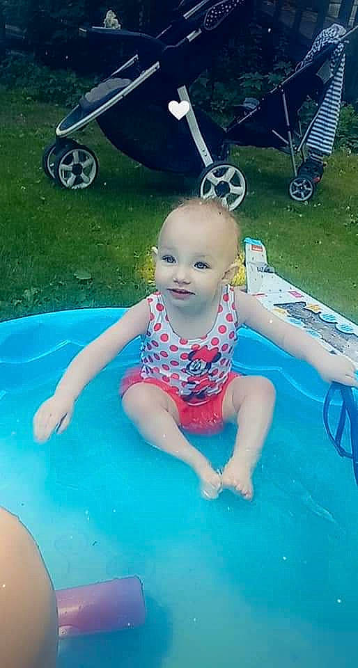 Hazel is registered to the contest to win money with this photo: aqua, azure, baby, baby_toddler_clothing, bathing, blue, child, electric_blue, fun, grass, green, happy, leisure, person, product, recreation, smile, summer, tire, toddler