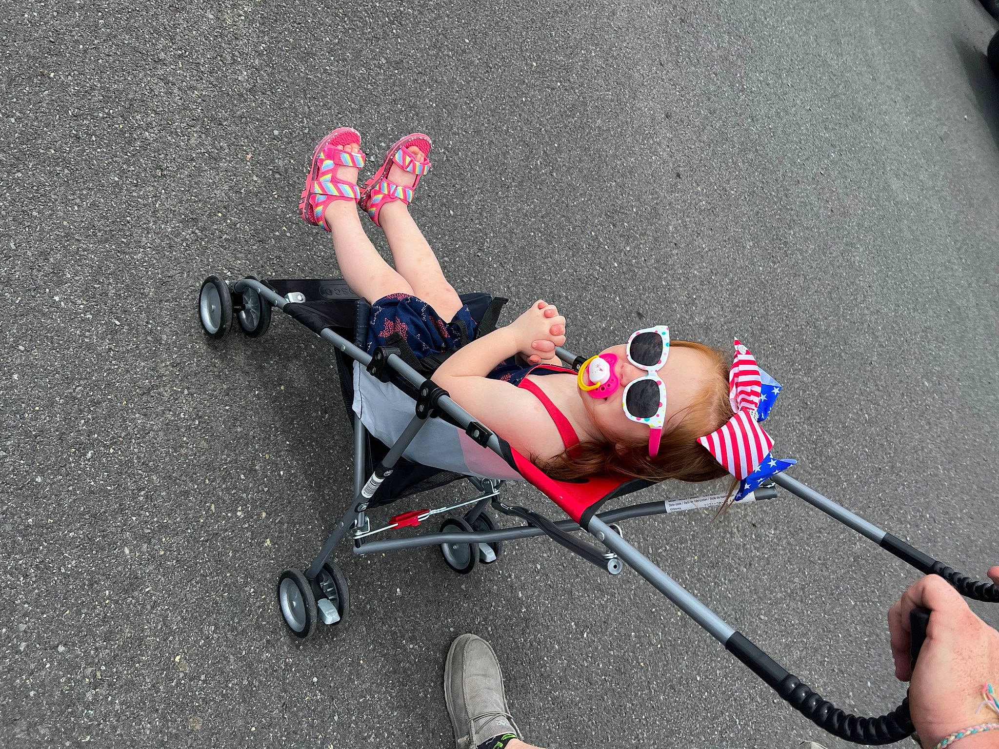 Adalynn is registered to the contest to win money with this photo: asphalt, auto_part, automotive_design, automotive_wheel_system, baby_products, carmine, fashion_accessory, fun, human_leg, knee, leg, leisure, motor_vehicle, person, recreation, road_surface, rolling, thigh, tire, toy