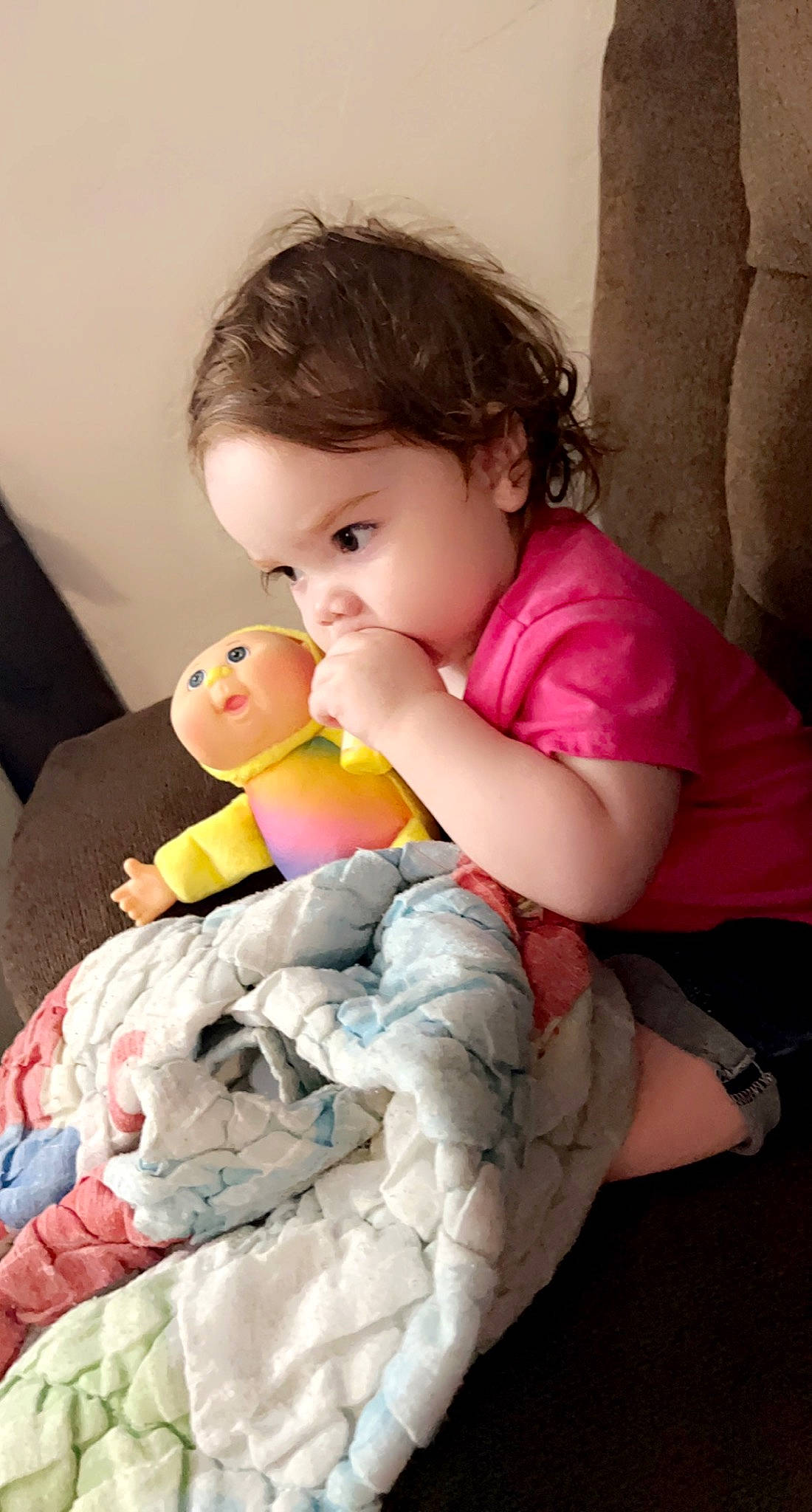 Maislynn is registered to the contest to win money with this photo: arm, baby, baby_toddler_clothing, cheek, child, comfort, facial_expression, fun, gesture, hairstyle, happy, joint, mouth, nose, person, pink, sitting, skin, stuffed_toy, toddler