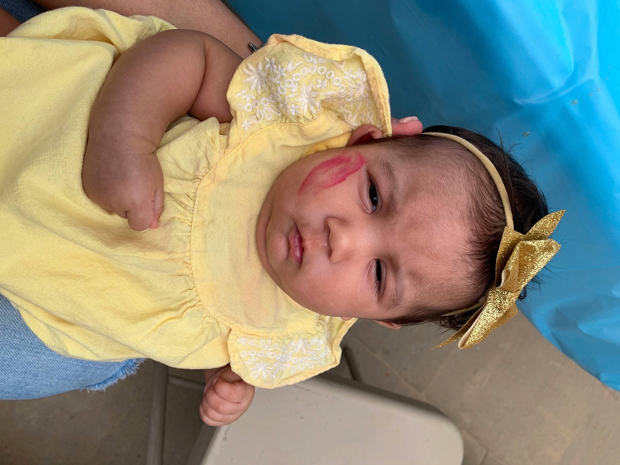Maya is registered to the contest to win money with this photo: baby, baby_products, baby_toddler_clothing, cheek, child, comfort, ear, eyebrow, eyelash, face, fashion_accessory, finger, happy, hat, headgear, iris, nose, person, skin, textile