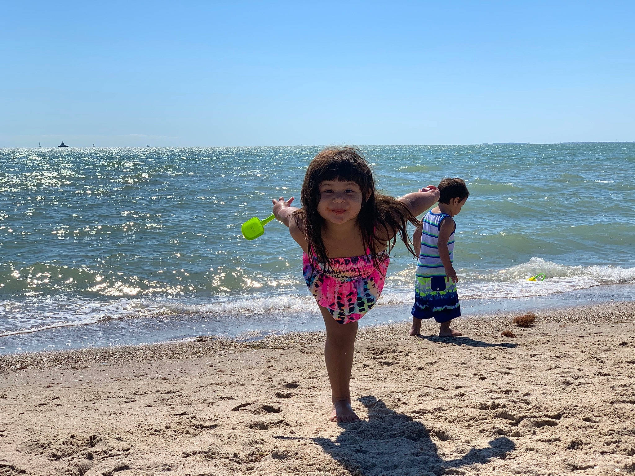 Malena joined the competition — help win amazing prizes! beach, coastal_and_oceanic_landforms, fun, happy, holiday, horizon, joy, lake, leg, leisure, people_in_nature, people_on_beach, person, sky, smile, summer, toddler, travel, tree, waist