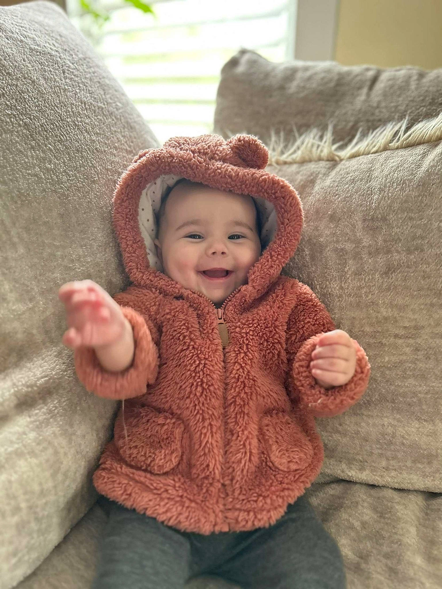 Mylee is registered to the contest to win money with this photo: baby, baby_toddler_clothing, cap, cheek, comfort, eye, face, fashion_accessory, flooring, fur, happy, headgear, headwear, jacket, joy, nose, outerwear, person, skin, sleeve