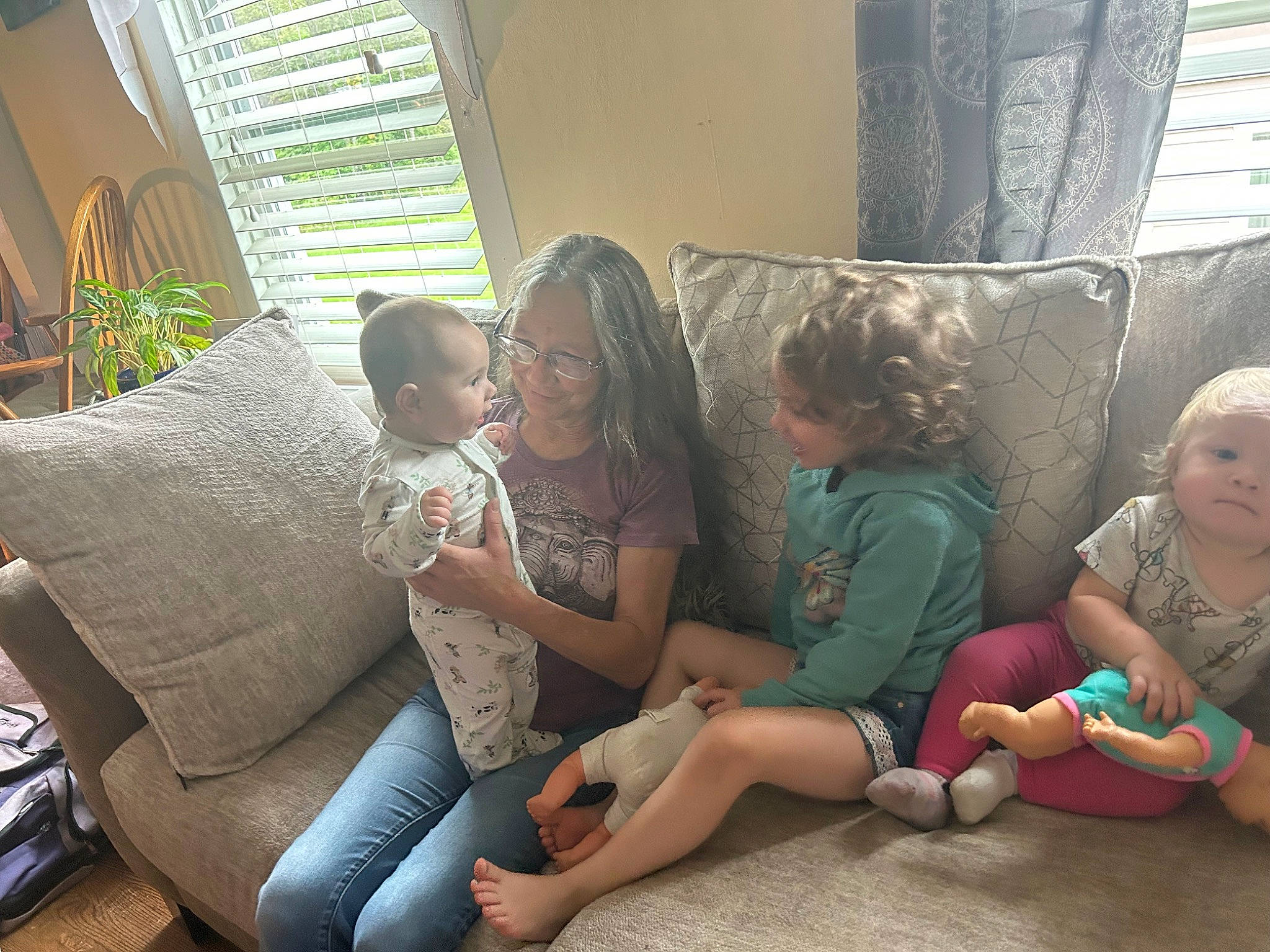 Mylee joined the competition — help win amazing prizes! baby, child, comfort, couch, event, flooring, fun, happy, head, human_leg, joy, lap, leisure, living_room, person, plant, room, sharing, sitting, skin