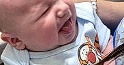 Curtis joined the competition — help win amazing prizes! baby, infant, smiling, onesie, tigger, winnie_the_pooh, holding, person, table, plate, mug, happy, cute, child, portrait, skin, indoor, people, clothing, baby_girl