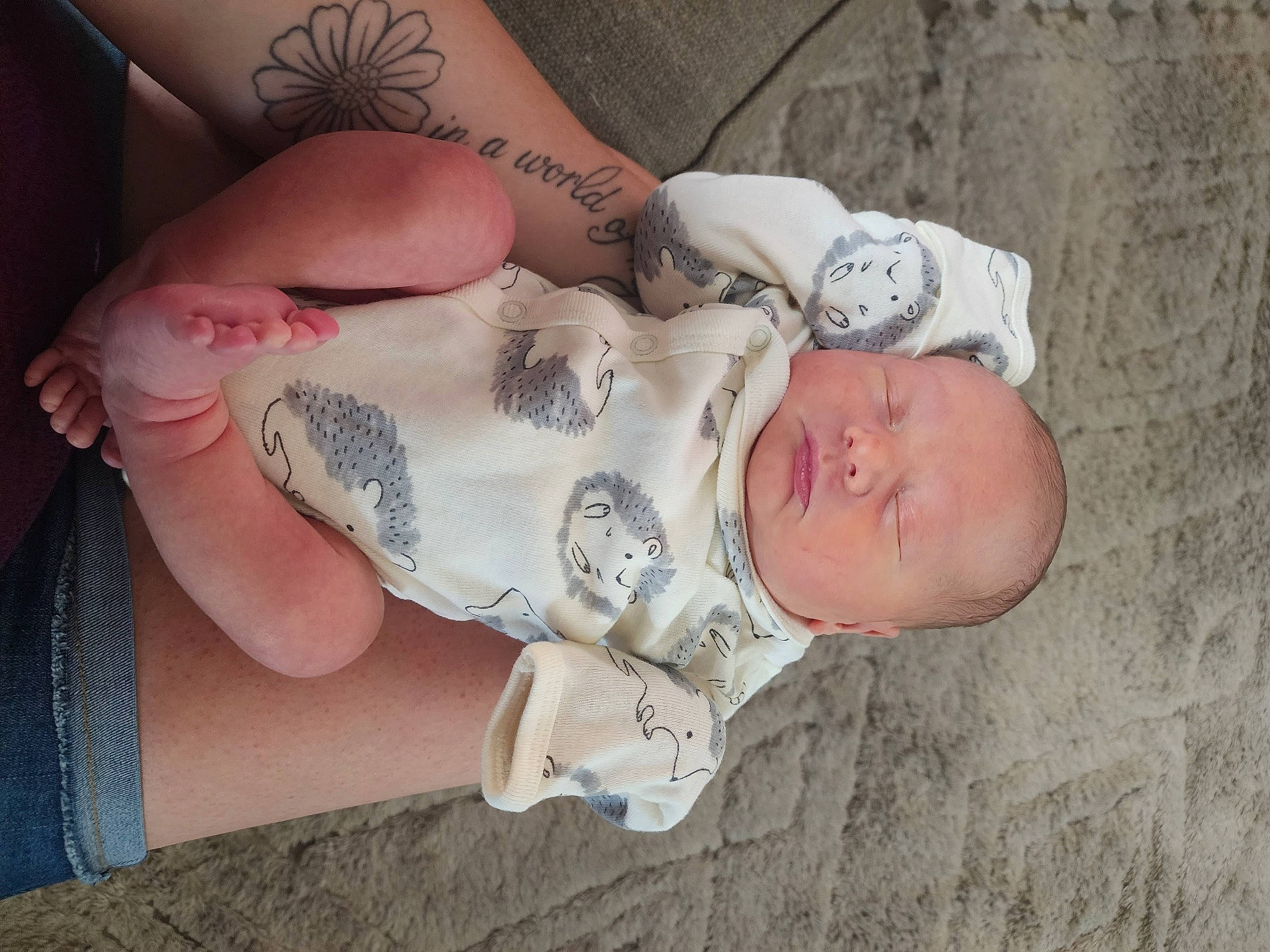 Weston joined the competition — help win amazing prizes! baby, baby_toddler_clothing, dress, eye, eyelash, finger, gesture, hand, head, human_body, human_leg, leg, nail, pattern, person, skin, sleeve, temporary_tattoo, toddler, tree