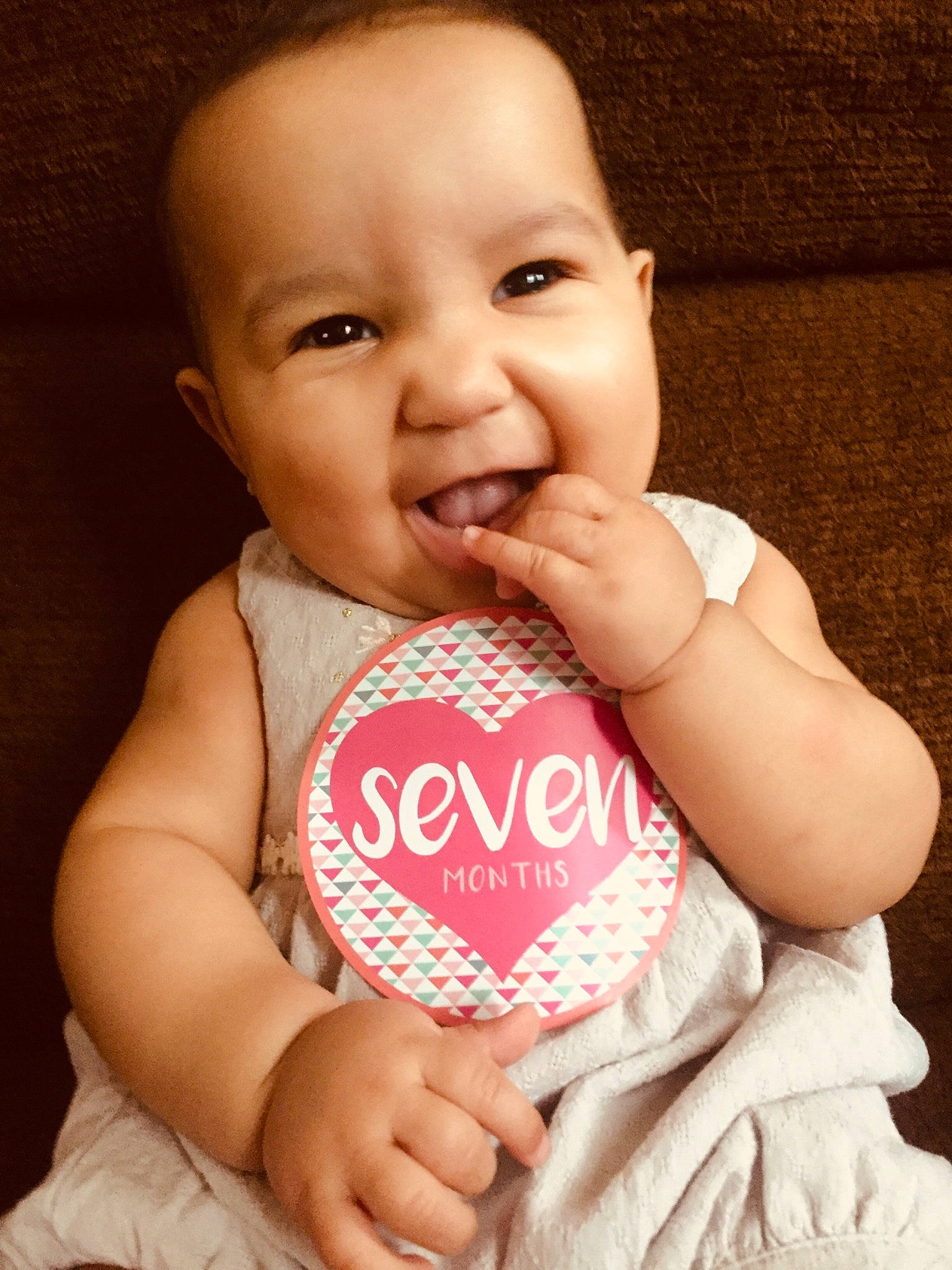 Alaska joined the competition — help win amazing prizes! baby, baby_toddler_clothing, cheek, child, facial_expression, joy, lip, nose, person, pink, sitting, skin, smile, toddler