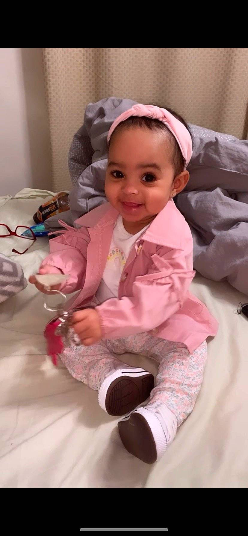 Malaya is registered to the contest to win money with this photo: baby, baby_products, baby_toddler_clothing, cheek, child, comfort, fashion_accessory, finger, fun, happy, headgear, joy, magenta, person, pink, purple, room, skin, sleeve, smile