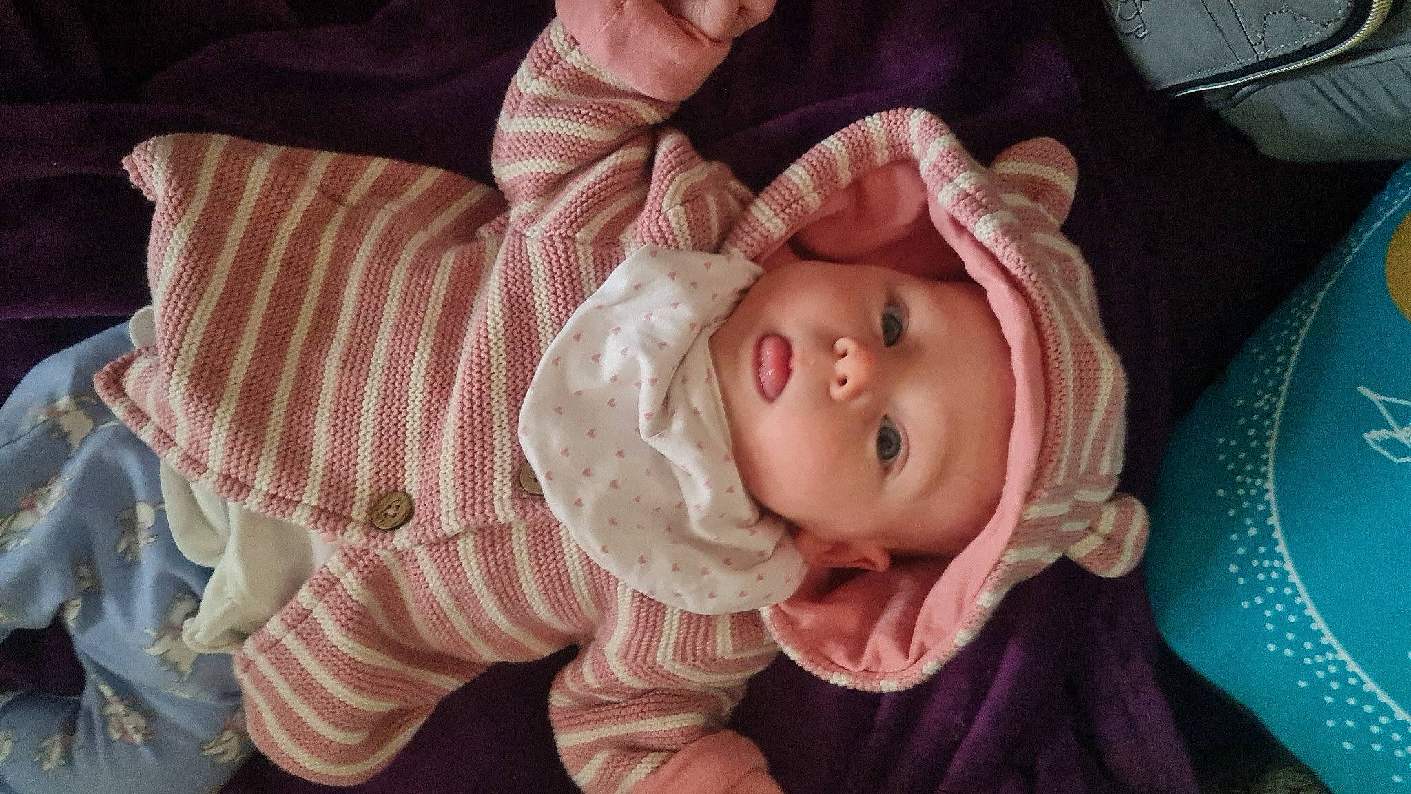 Constance is registered to the contest to win money with this photo: baby, baby_toddler_clothing, cheek, chin, ear, eye, eyebrow, eyelash, face, facial_expression, hand, head, headwear, human_body, iris, lip, mouth, nose, person, skin
