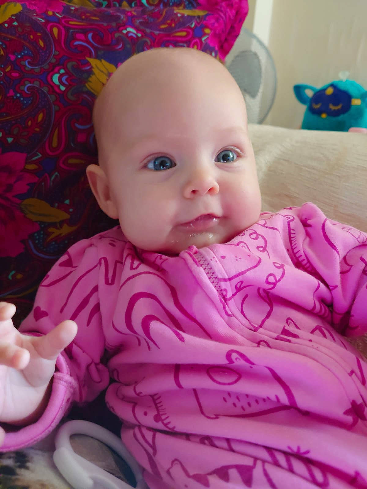 Constance is registered to the contest to win money with this photo: baby, baby_toddler_clothing, cheek, comfort, eye, happy, head, iris, linens, lip, magenta, nose, person, pink, purple, skin, sleeve, smile, textile, toddler