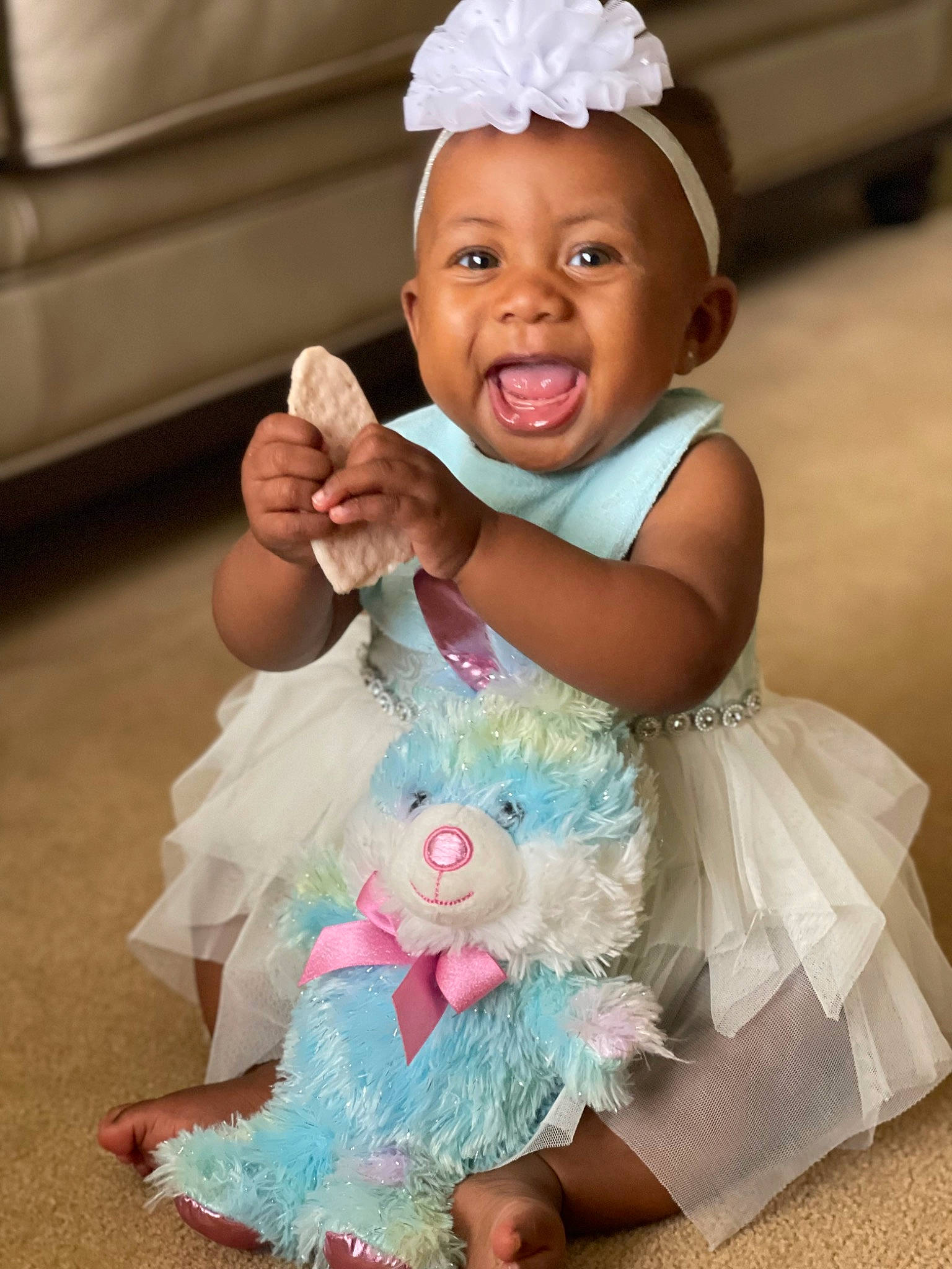Abiona is registered to the contest to win money with this photo: arm, baby, baby_products, baby_toddler_clothing, child, dress, event, fun, gesture, hand, happy, hat, headpiece, magenta, person, pink, skin, smile, thumb, toddler