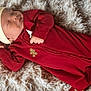 Carsyn is registered to the contest to win money with this photo: baby, sleeping, red_onesie, santa_hat, holiday, cozy, fluffy_rug, infant, peaceful, cute, child, portrait, soft_texture, indoors, holiday_outfit, resting, newborn, smiling, festive, warm