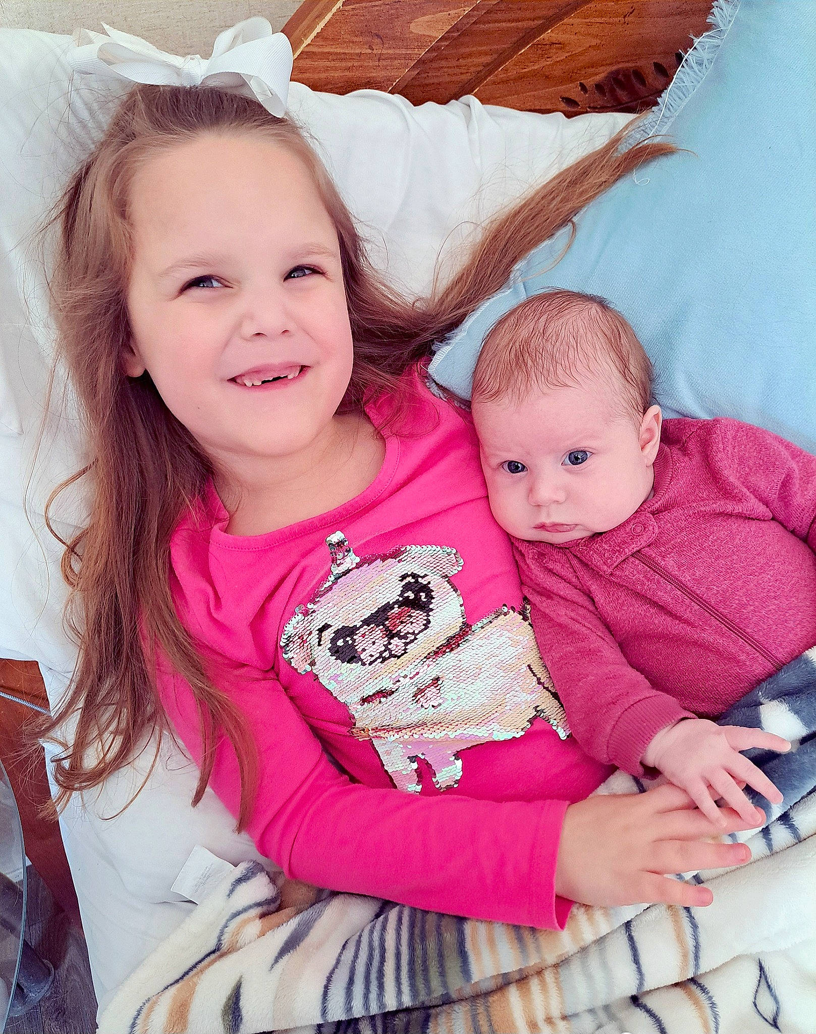 Delilah is registered to the contest to win money with this photo: baby, baby_toddler_clothing, cheek, child, comfort, eye, face, facial_expression, fun, happy, iris, joy, lap, magenta, person, pink, skin, sleeve, smile, textile