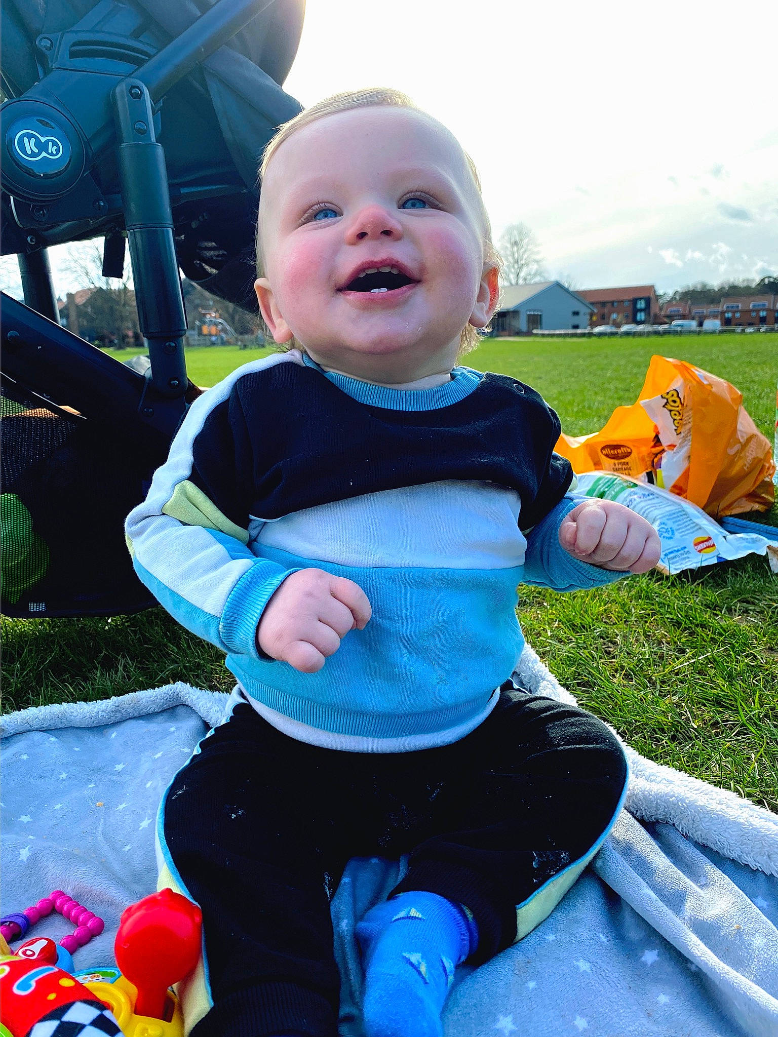 Harvey joined the competition — help win amazing prizes! automotive_tire, baby_toddler_clothing, child, cloud, electric_blue, fun, grass, happy, leisure, people_in_nature, person, personal_protective_equipment, plant, recreation, sitting, sky, smile, t_shirt, tire, toddler