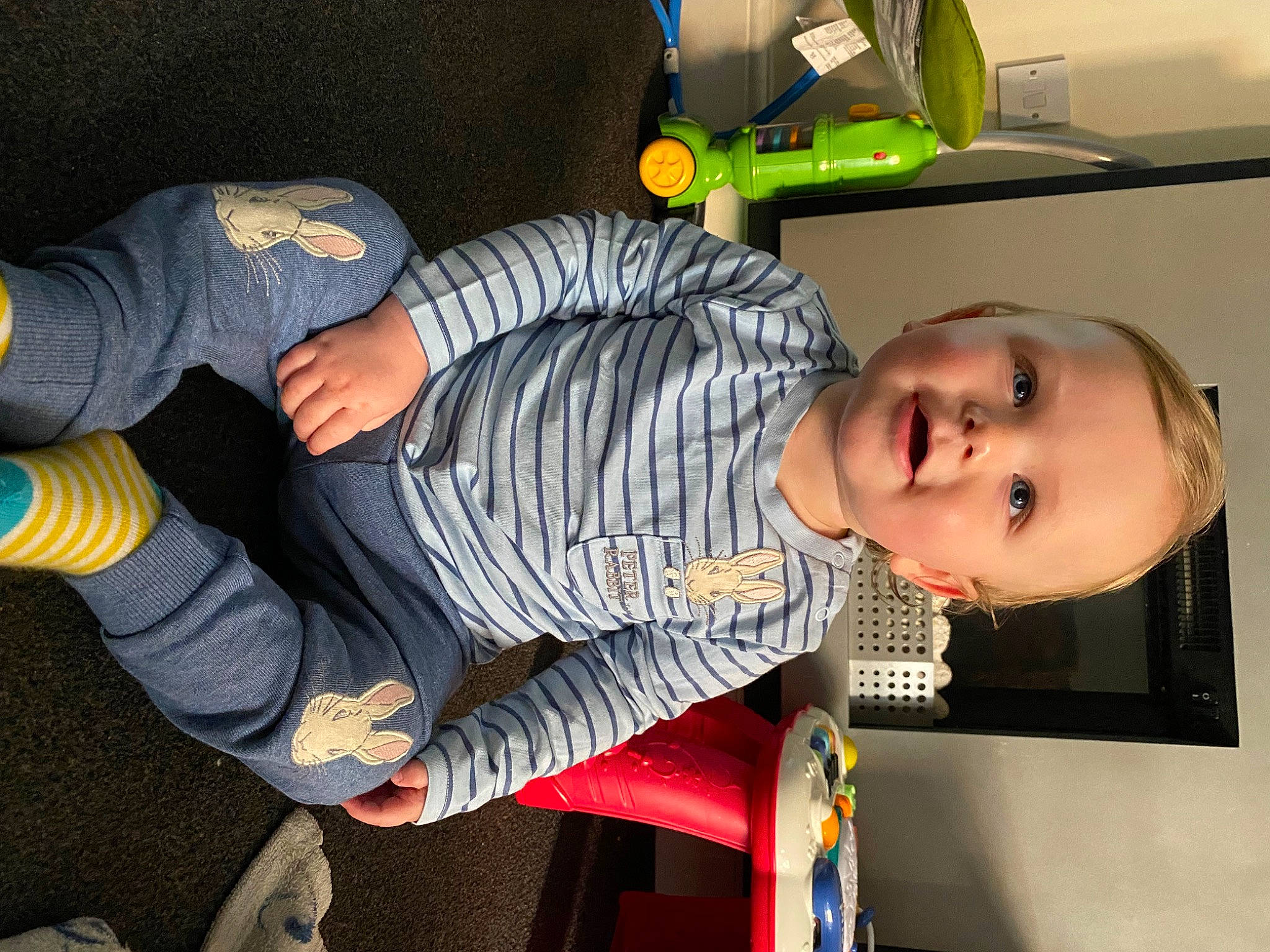 Harvey is registered to the contest to win money with this photo: baby, baby_products, child, comfort, denim, fun, human_leg, joy, knee, lap, person, room, sitting, smile, thigh, toddler