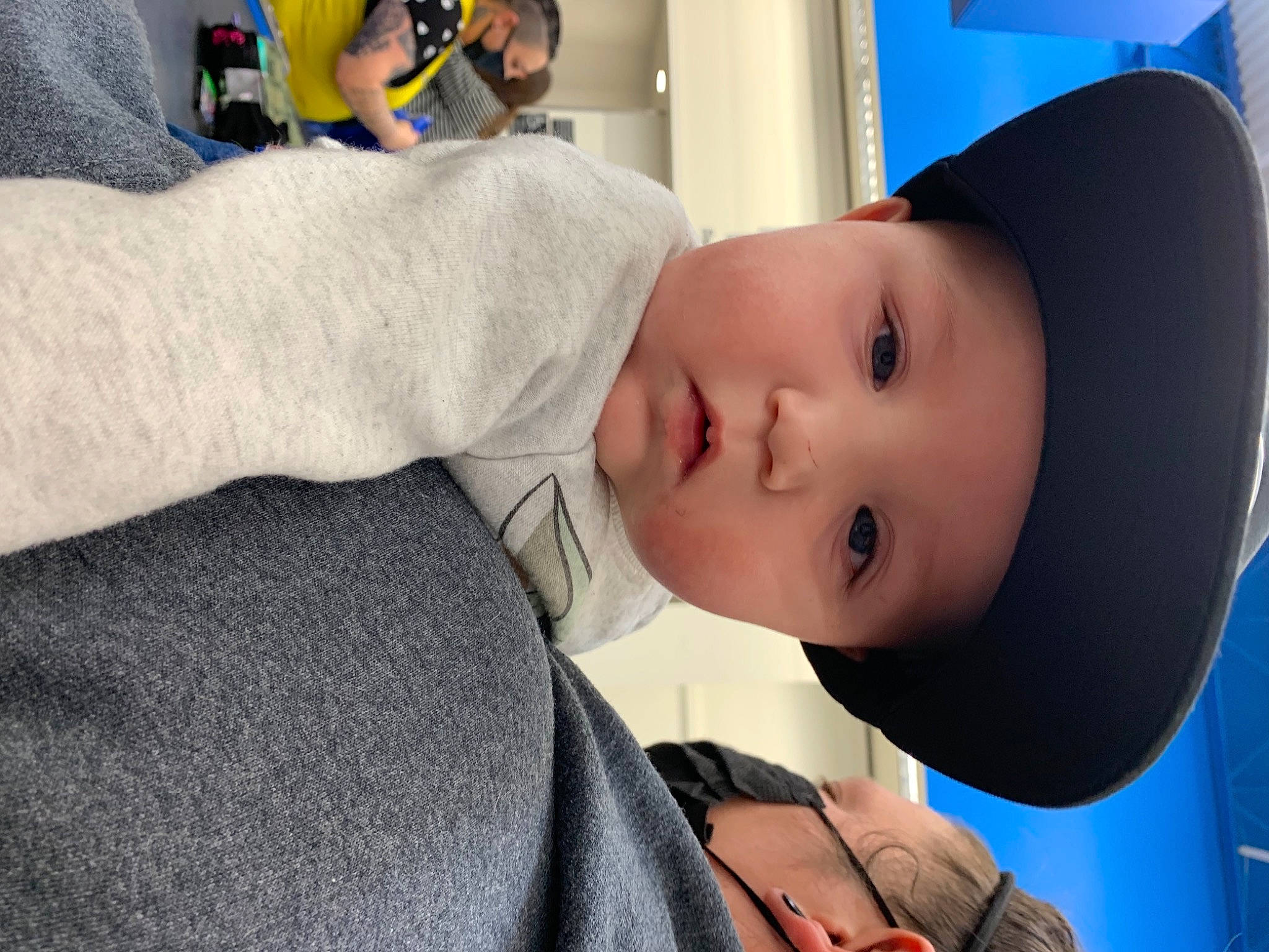 Frederick is registered to the contest to win money with this photo: baby, cheek, child, chin, clothing, comfort, ear, electric_blue, eyebrow, eyelash, fashion_accessory, fun, headwear, lip, mouth, neck, nose, person, personal_protective_equipment, skin