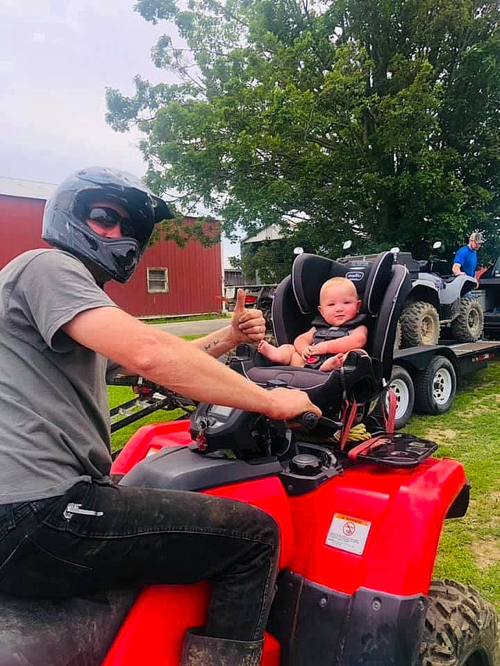 Frederick is registered to the contest to win money with this photo: adventure, auto_part, automotive_design, automotive_exterior, automotive_tire, automotive_wheel_system, bumper, fender, fun, headwear, helmet, motor_vehicle, person, personal_protective_equipment, recreation, shorts, tire, tractor, tread, tree