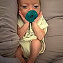 baby, infant, pacifier, cushion, onesie, hands, face, skin, comfort, soft, sleepy, newborn, cute, small, lying, resting, indoors, child, person, cozy