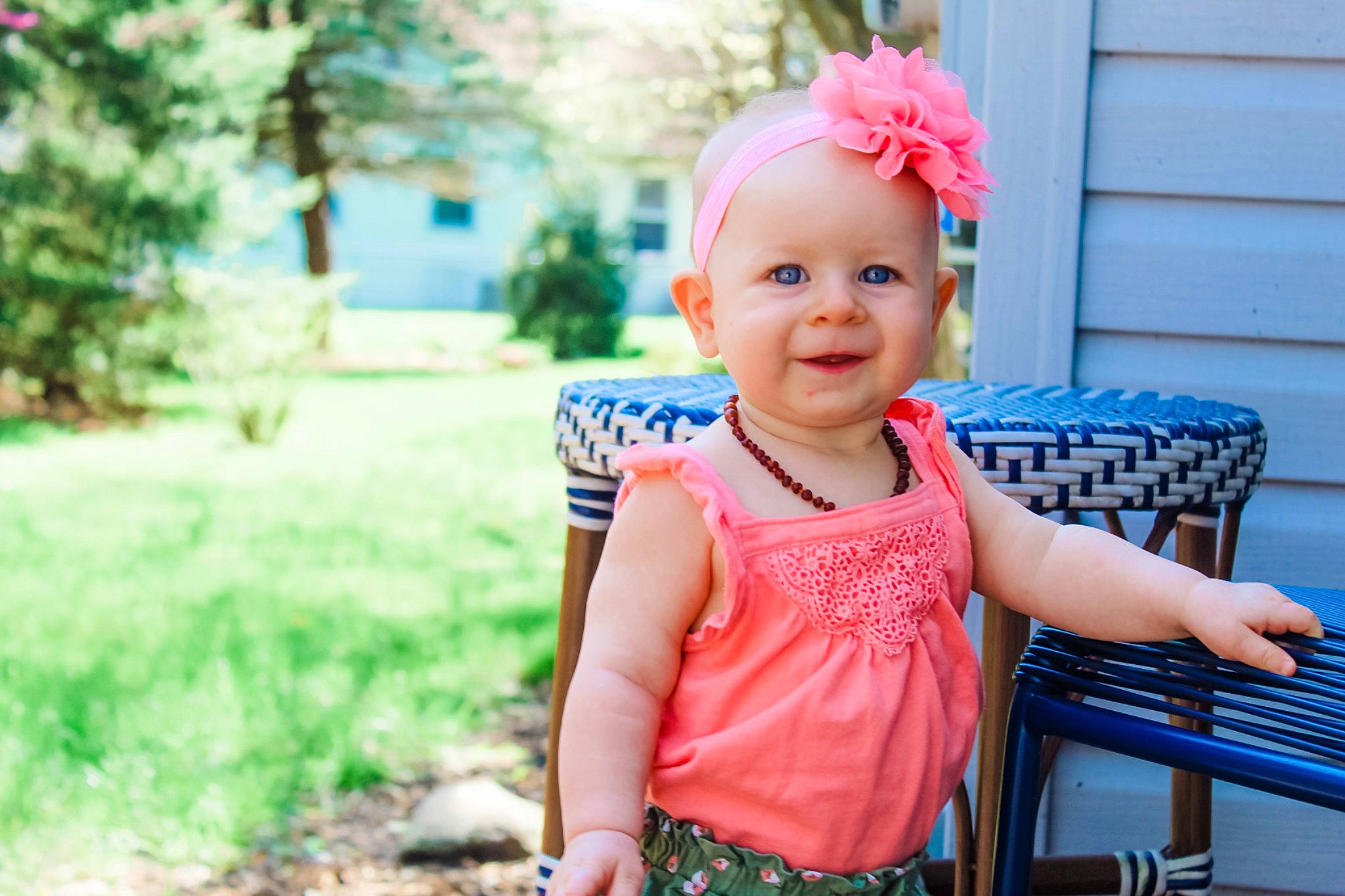 Everlyn is registered to the contest to win money with this photo: baby, baby_toddler_clothing, blue, chair, child, eye, fun, grass, happy, hat, headwear, joy, leisure, magenta, pattern, person, pink, plant, recreation, smile