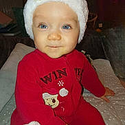 Lyam participe au concours pour gagner de l'argent avec cette photo : baby, blanket, blue_eyes, child, cozy, cute, face, festive, hand, holiday, indoor, infant, noel, portrait, red_onesie, seated, smile, soft_lighting, warm_clothing, winter_hat