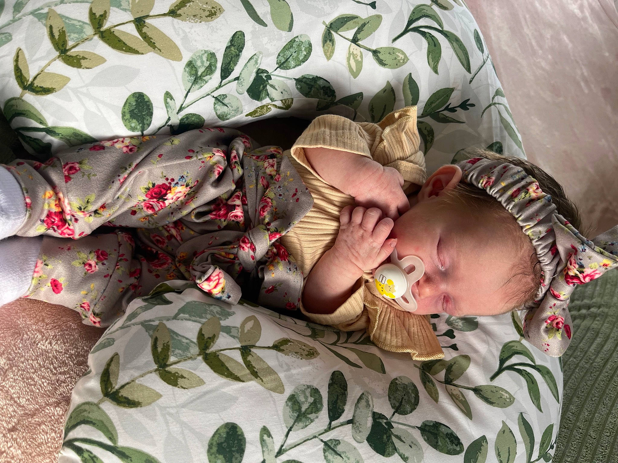 Avalyn is registered to the contest to win money with this photo: arm, baby, baby_products, baby_toddler_clothing, bed, bedtime, camouflage, child, comfort, eye, face, grass, head, human_body, linens, military_camouflage, pattern, person, toddler, tree