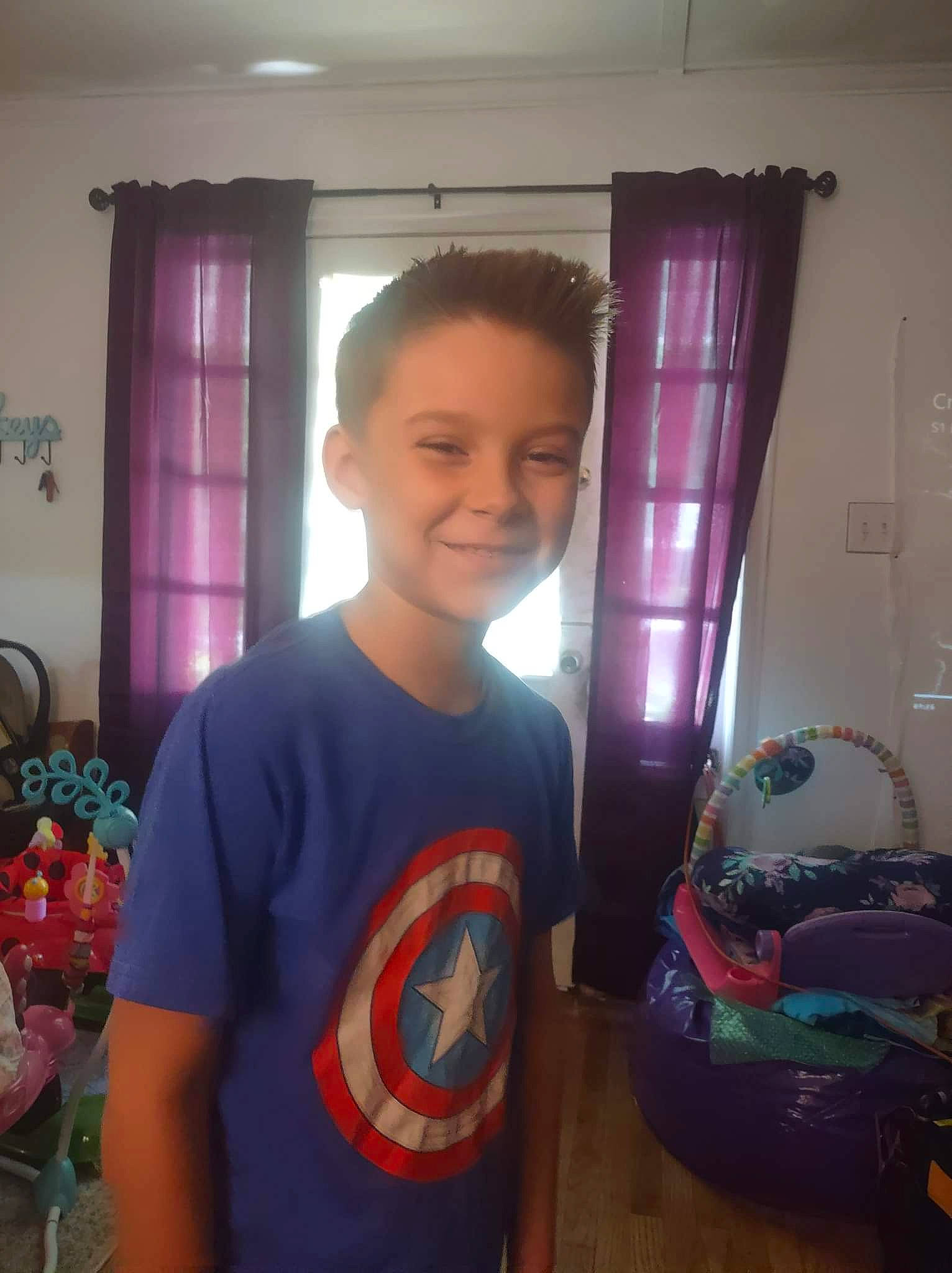 Tristen joined the competition — help win amazing prizes! automotive_lighting, bumper, child, curtain, family_car, flooring, fun, happy, holiday, home_appliance, joy, magenta, person, play, refrigerator, room, smile, standing, t_shirt, toddler