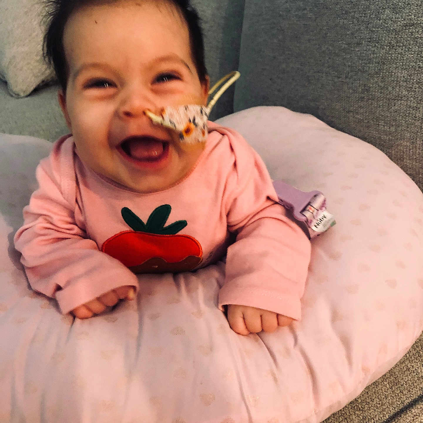 Camila is registered to the contest to win money with this photo: baby, babylaughing, blade, clothing, couch, cushion, cutlery, face, furniture, glove, happy, head, homedecor, laughing, person, photography, portrait, smile, spoon, text