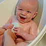 Erik joined the competition — help win amazing prizes! baby, bathtub, bath, child, sponge, water, smiling, happy, skin, hand, adult_hand, foam, cleaning, infant, child_bathing, indoor, person, tub, care, joy