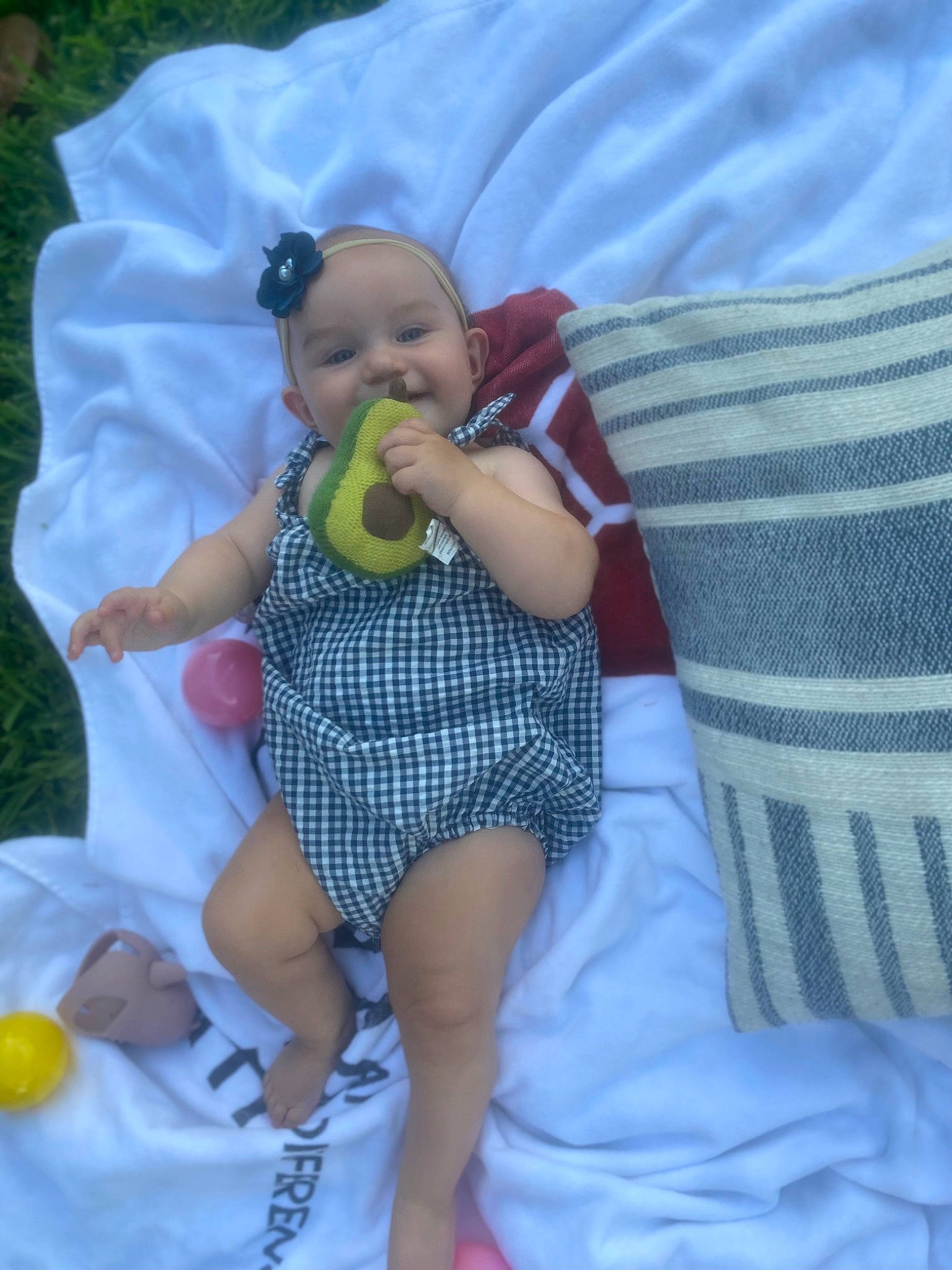 Lovie is registered to the contest to win money with this photo: baby, baby_products, baby_toddler_clothing, child, comfort, event, finger, foot, fun, grass, happy, human_leg, lap, leisure, linens, pattern, person, sitting, textile, thigh