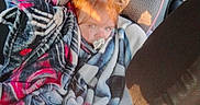 Robin joined the competition — help win amazing prizes! child, car_seat, blanket, pacifier, car_interior, sunlight, window, seat, headrest, red_hair, cozy, toddler, seatbelt, child_safety, portrait, car_backseat, fabric, pattern, daylight, young_child