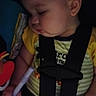 baby, black, car_seat, child, closeup, clothing, cute, face, hand, indoor, infant, naptime, peaceful, portrait, rest, seatbelt, sleeping, toy, yellow, young