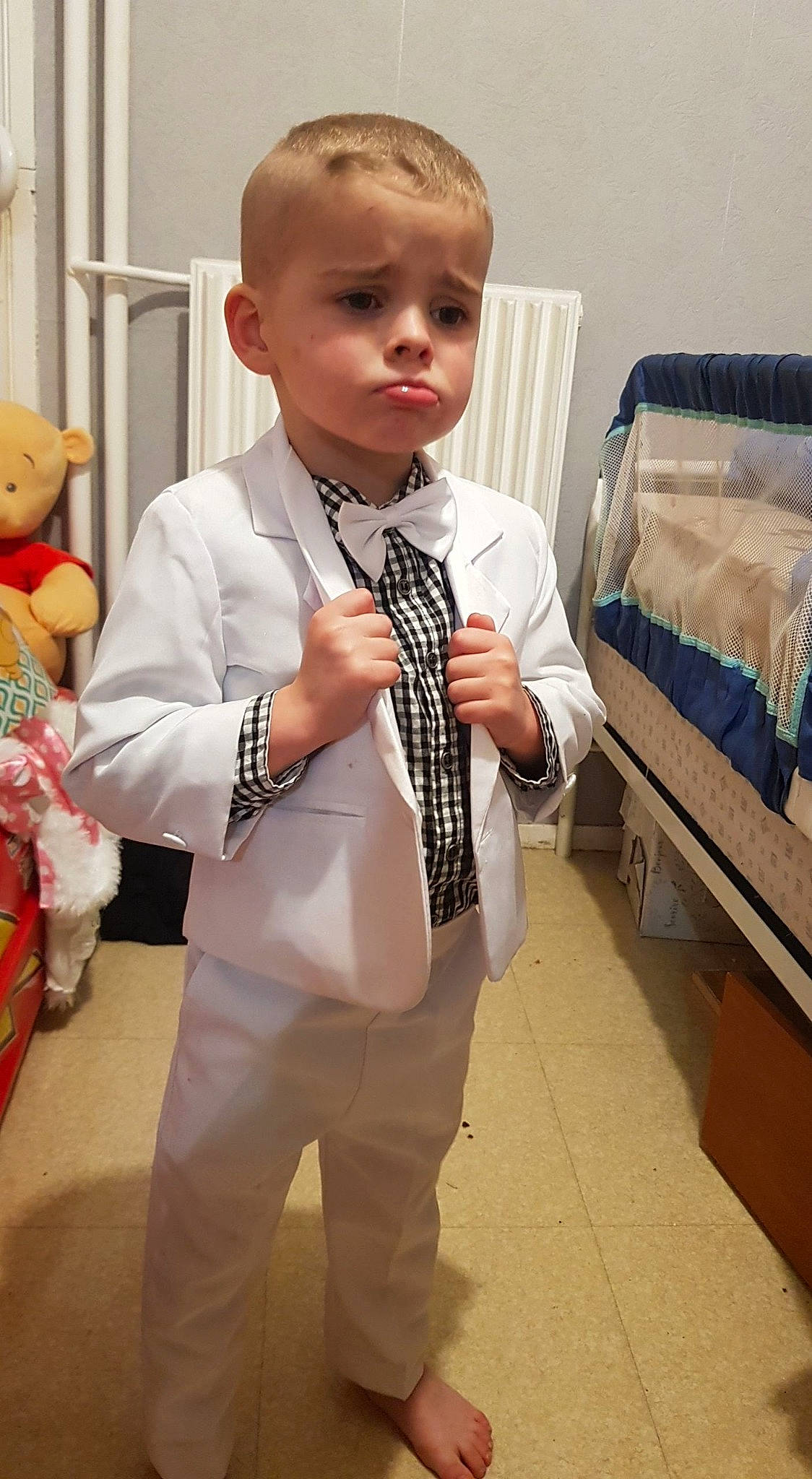 Evan participe au concours pour gagner de l'argent avec cette photo : baby_toddler_clothing, blazer, collar, dress_shirt, event, fashion_accessory, fashion_design, formal_wear, neck, pattern, person, room, shoulder, sleeve, suit, teddy_bear, tie, toddler, toy, waist