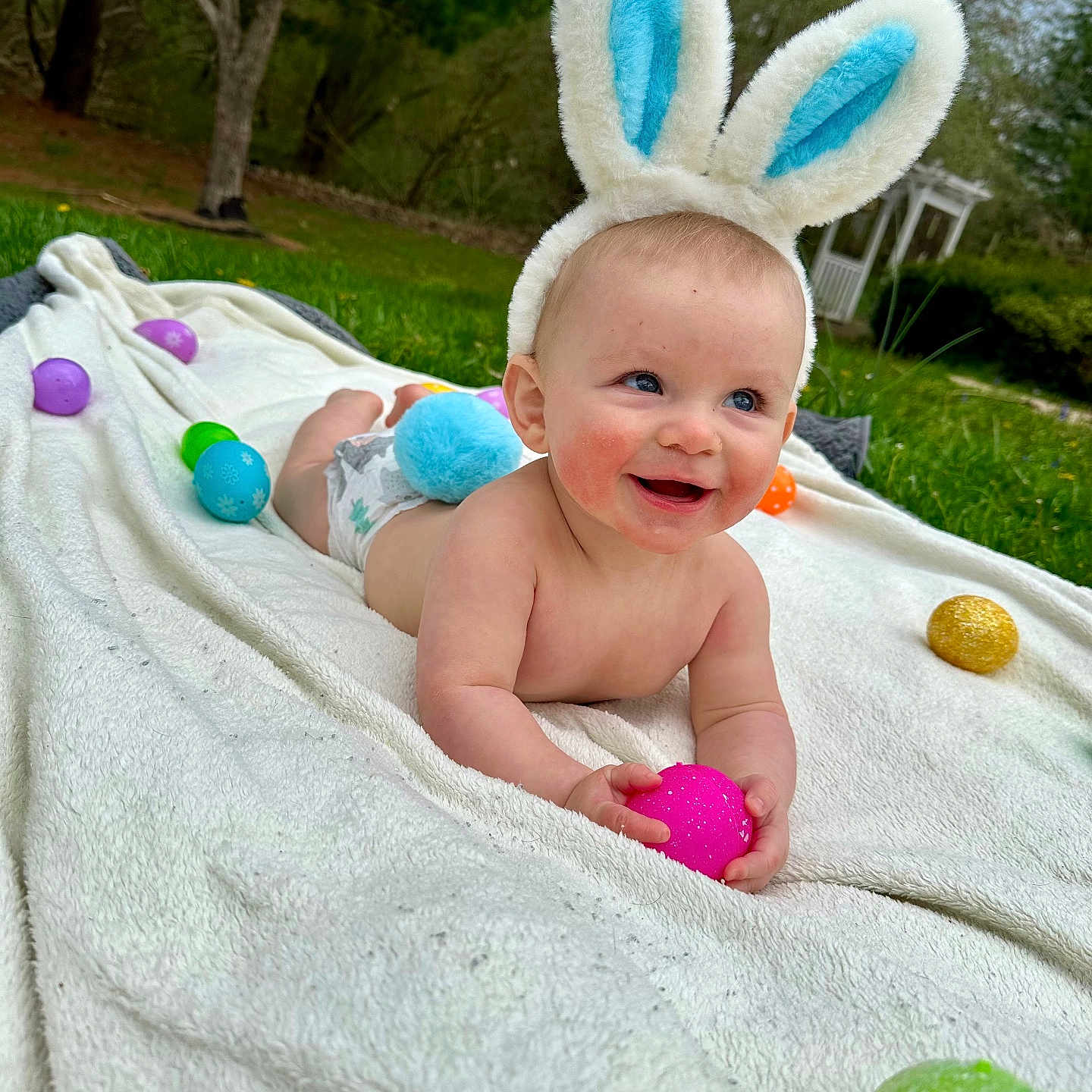 Kohen is registered to the contest to win money with this photo: baby, backyard, blanket, diaper, face, grass, happy, head, nature, outdoors, park, person, photography, plant, portrait, quilt, summer, towel, tree, yard