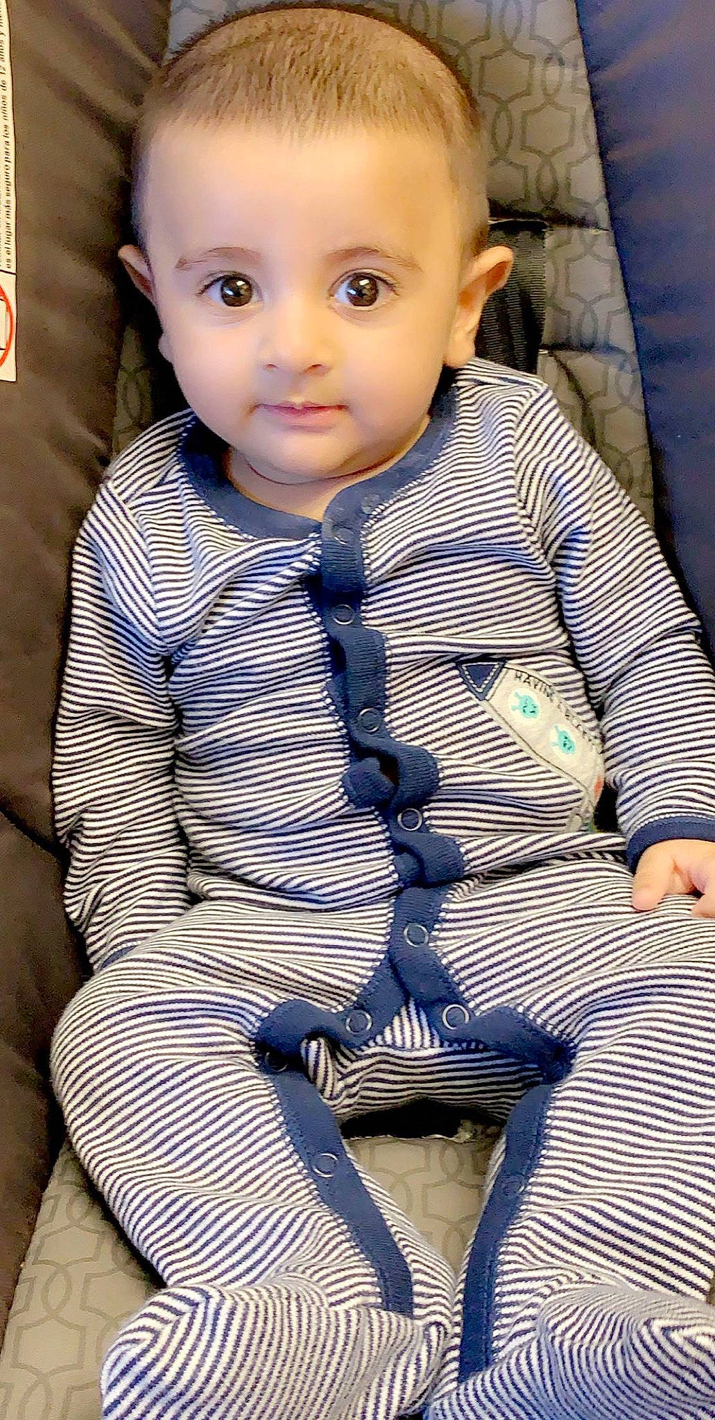 Wali is registered to the contest to win money with this photo: baby, cheek, child, child_model, face, outerwear, person, sitting, skin, toddler