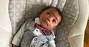 D'Vaun joined the competition — help win amazing prizes! baby, infant, child, vest, bow_tie, clothing, pattern, baby_rocker, furniture, curly_hair, looking_up, skin, hand, feet, cute, indoors, portrait, relaxing, small, adorable