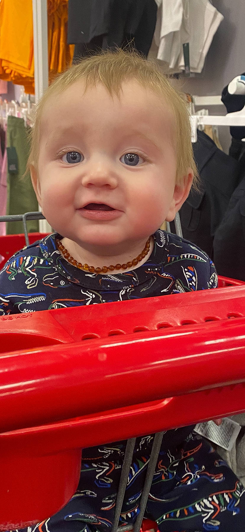 Miklo is registered to the contest to win money with this photo: automotive_exterior, baby, baby_toddler_clothing, blond, cheek, child, event, eye, flooring, fun, iris, motor_vehicle, nose, person, play, sitting, skin, smile, t_shirt, toddler